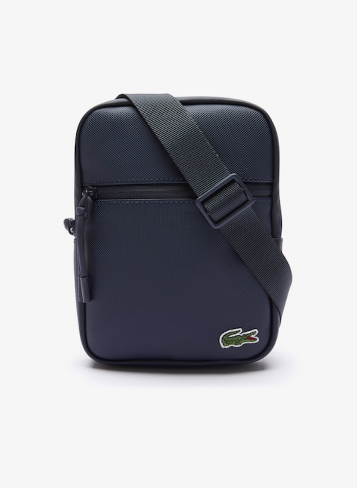 
                      
                        LACOSTE Petite sacoche plate LCST croisée en toile enduite
                      
                    